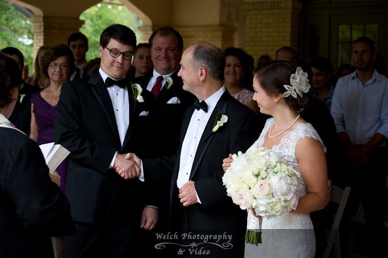 Bride and father greeting groom at wedding ceremony
