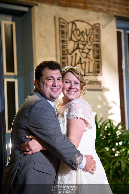 Bride and Groom with Rosy's sign